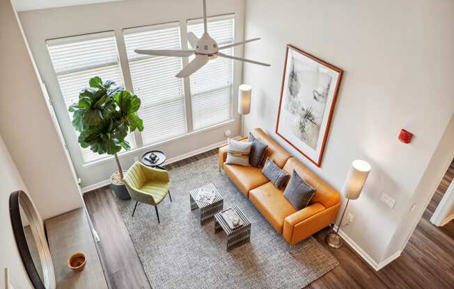 an overhead view of a living room with a couch and chairs at Metro 303, New York