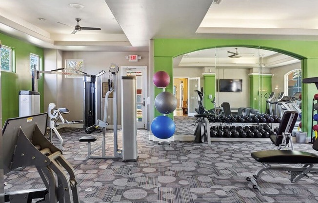 Fitness center with weight lifting equipment at Reserve at Rancho Apartments