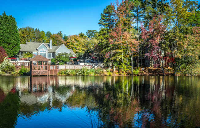 a view of a lake with a house in the background at Radbourne Lake Apartments, Charlotte North Carolina? 