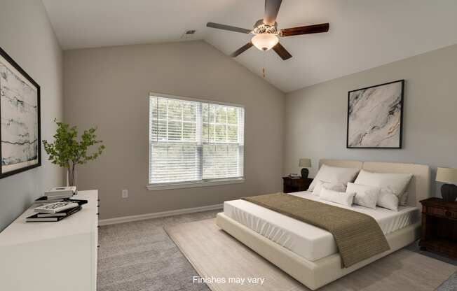 a bedroom with a bed and a ceiling fan