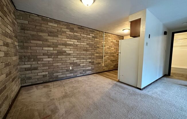 Cozy One Bedroom with Beautiful Exposed Brick! Off-Street Parking & Laundry Included!