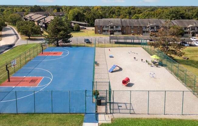 an aerial view of a basketball court at a city park