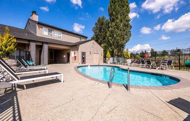 The Stinson Apartment Homes Pool with Lounge Chairs