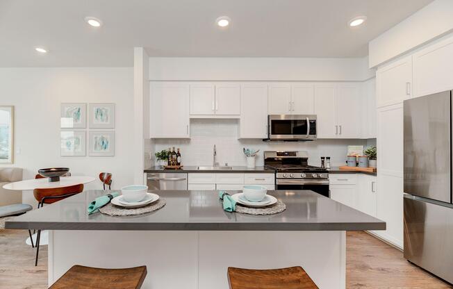 a kitchen with an island in the middle of a room