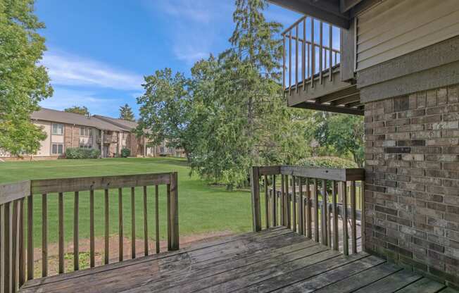the view of a yard from the balcony of a house at Edge At Farmington Hills - Farmington Hills, MI, Michigan, 48334