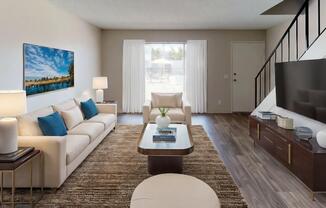 a living room with a couch a table and a television