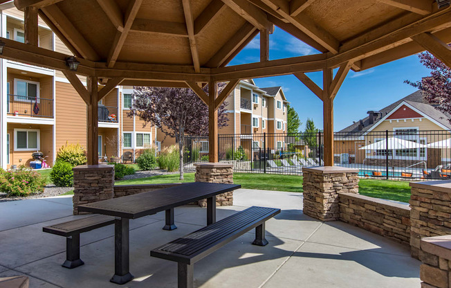 an outdoor patio with a pavilion in front of an apartment building  at Quail Springs, West Richland, 99353