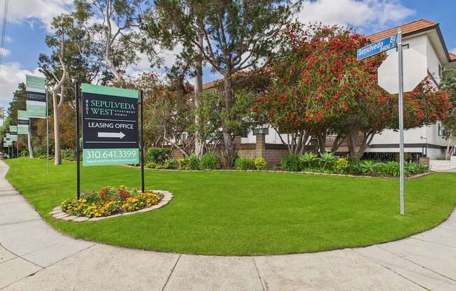 A leasing office sign for Sepulveda West is in front of a building.