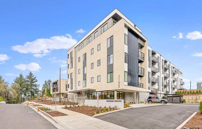 a view of the front of the building with a blue sky in the background