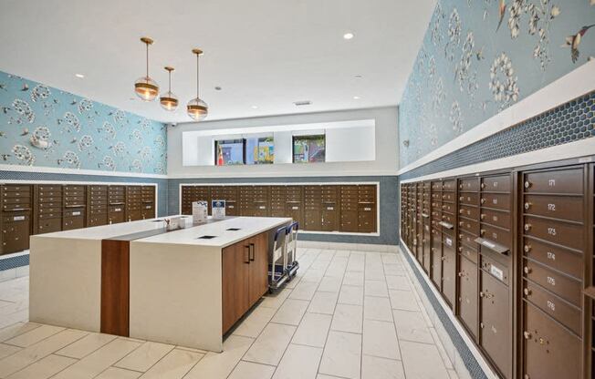 the locker room at the gym with lockers and counters and blue wallpaper at Link Apartments® 4th Street, North Carolina