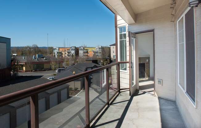 a balcony with a view of the city in the distance