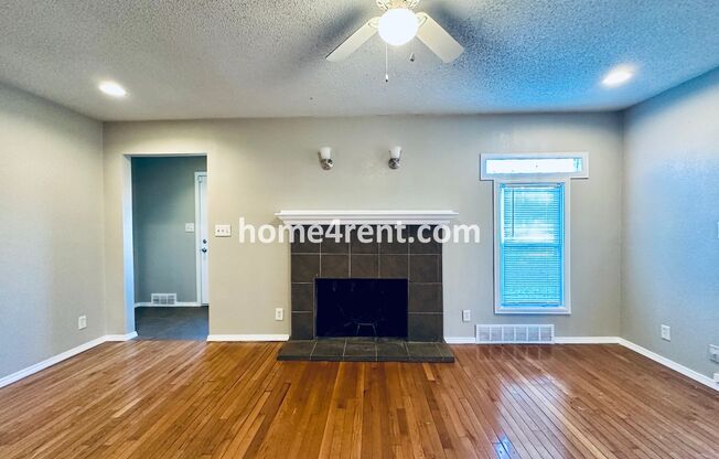 Adorable Home Featuring Wood Floors, SS Appliances, Updated Bathrooms and Plenty of Natural Light!