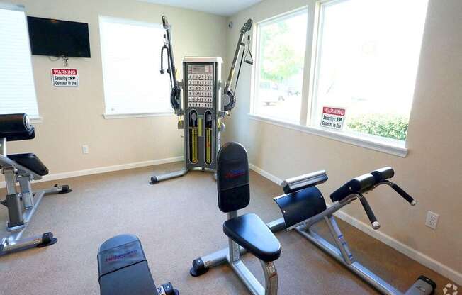 a gym with cardio equipment in a home gym