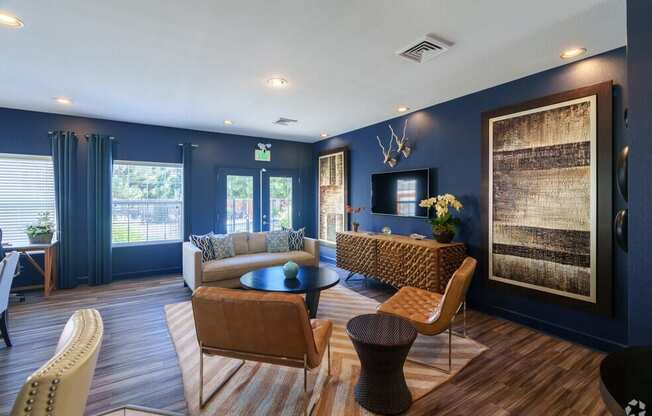 a living room with blue walls and a couch and a table