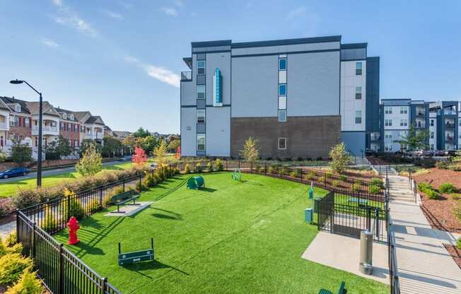 a large yard with a building in the background