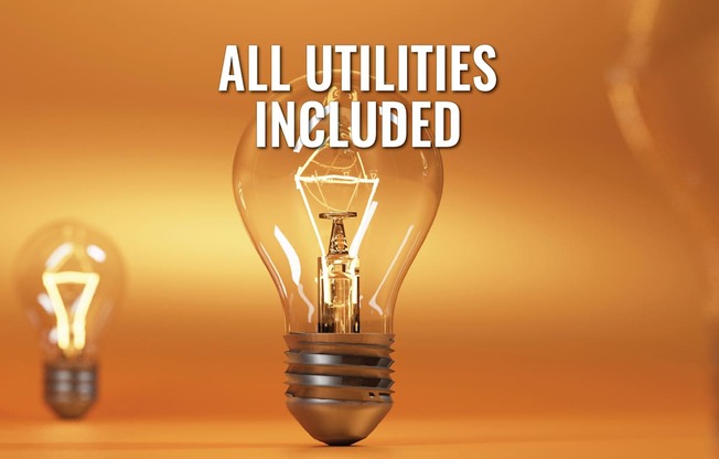 A lit light bulb with the text "ALL UTILITIES INCLUDED" in front of it.
