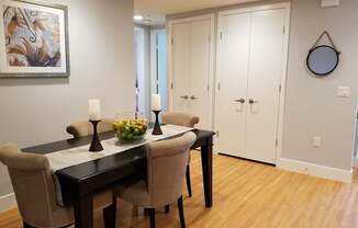 A dining room with a table set for two at Woodley Sara Apartment, California