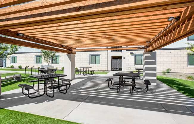 Apartments Phoenix, AZ - Outdoor Community BBQ Area with Picnic Tables and Pergola