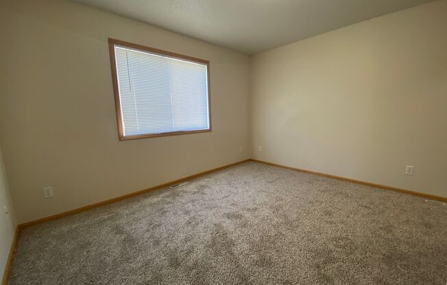 Spacious South Moorhead Twinhome with Double Garage & Prime Location!