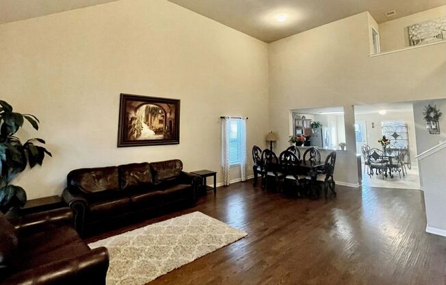 Elegant four‑bedroom corner‑lot home with hardwood floors, modern kitchen, master suite, and community amenities near Hwy I‑20.