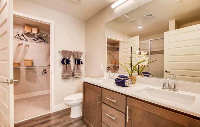 A bathroom with a white toilet and a white sink.