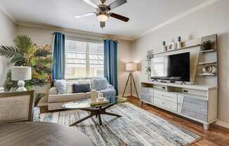 a living room with a couch and a tv