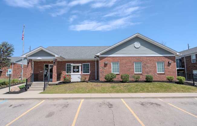 a brick building with an flag in front of it