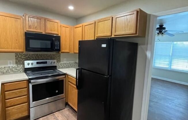 Must see this 4 bedroom 2.5 bath townhouse with 1 car garage .