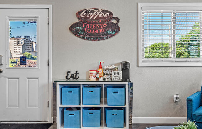 a living room with a drink cabinet and a door