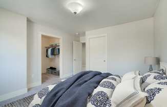 a bedroom with a bed and a closet at Copper Pines, Bozeman, MT