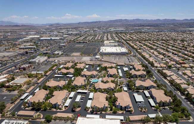 A large aerial view of a commercial area with buildings and roads.