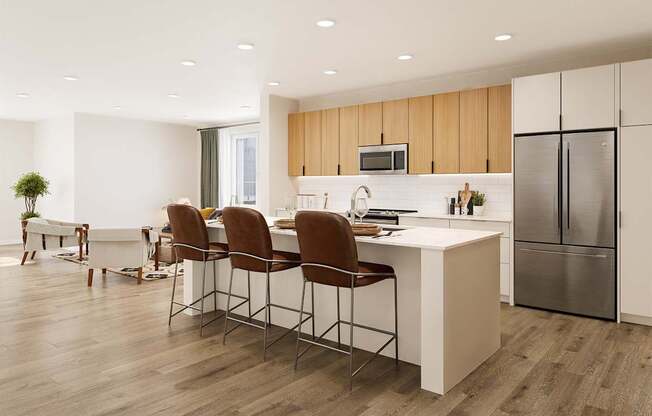 A modern kitchen with a white island and brown chairs.