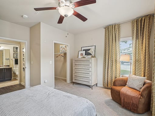 Modern apartment bedroom with large windows and contemporary finishes in Apex, NC