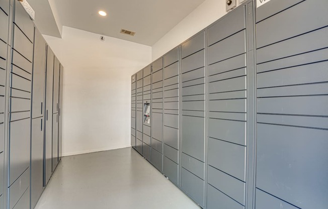 Package locker room with secure storage units at Vue Live Oak Apartments, Dallas, Texas