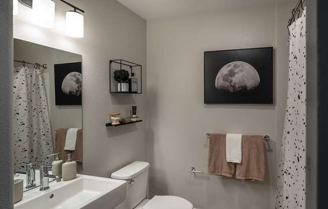 a small bathroom with a toilet sink and shower