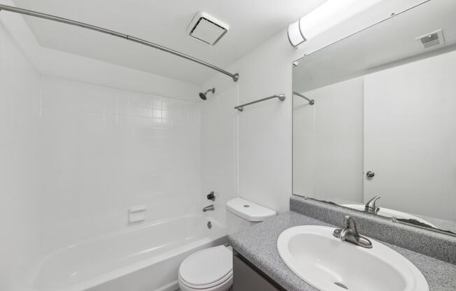 a bathroom with a sink toilet and a bath tub