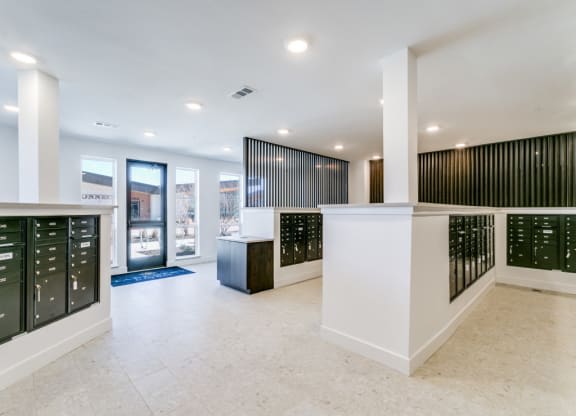 A white reception area with black and white striped walls.