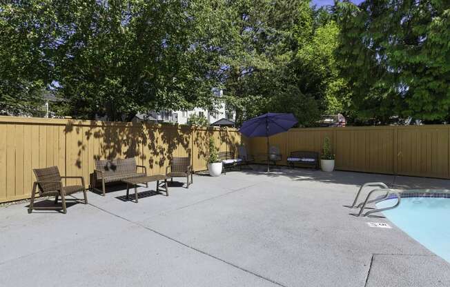 Pool and Lounge Area with Patio Furniture at Casa Blanca Apartment Homes, Washington, 98204