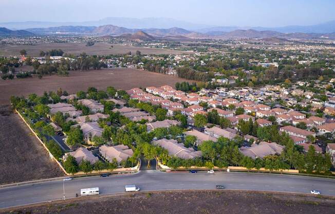 A residential area with houses and a road.