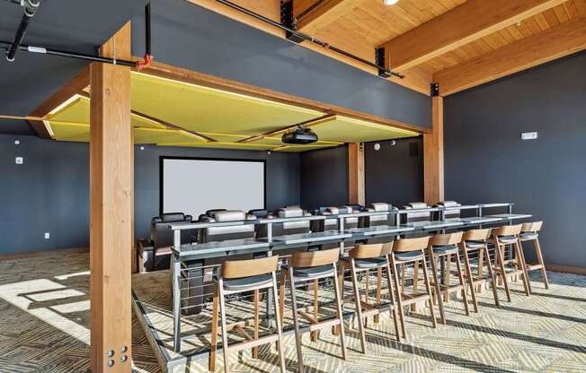 A conference room with a long table and chairs.