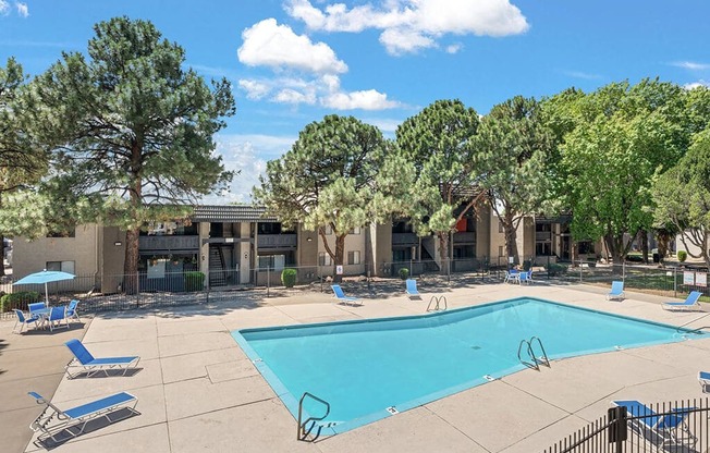 a render of a swimming pool with trees and a blue sky above it