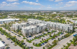 an aerial view of an urban area with many apartment buildings and cars