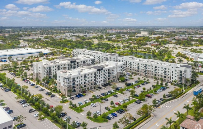 an aerial view of an urban area with many apartment buildings and cars