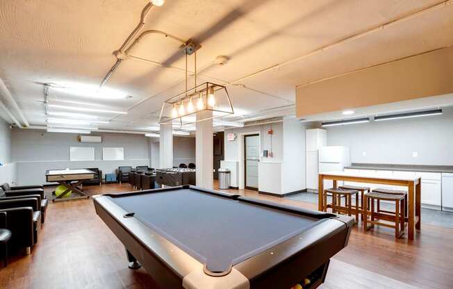 Game room with a pool table at Mason Hall in Alexandria, VA 22314