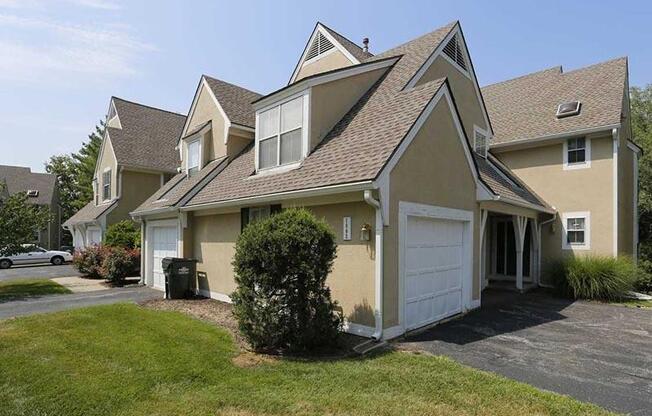 a house with a garage and a grassy yard