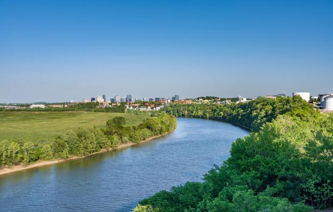 Sweeping river views with Nashville’s skyline in the distance, placing residents near green space, waterfront vistas, and the city’s creative energy.