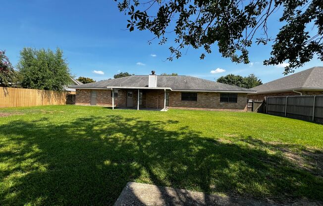 4 Bedroom, 2 Bathroom, large yard, 2 car carport, NEW floors and paint.