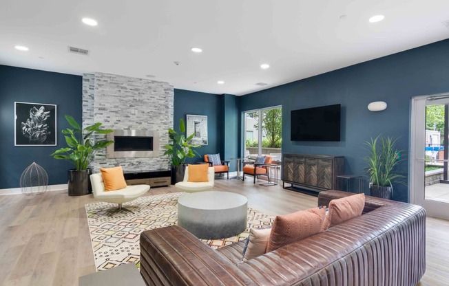resident lounge with modern furnishings and fireplace