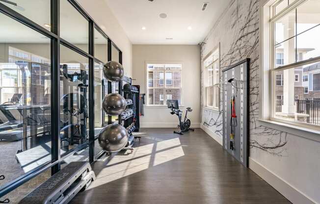 the gym at the district flats apartments in lenexa