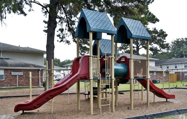 a playground with a slide and other playground equipment